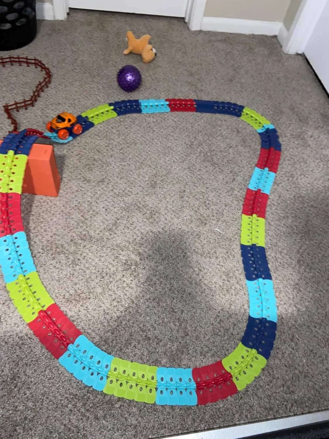 Flexible Race Track Car Toy with Easy Track Assembly and LED Light-Up Car, Safe for Ages 3+.